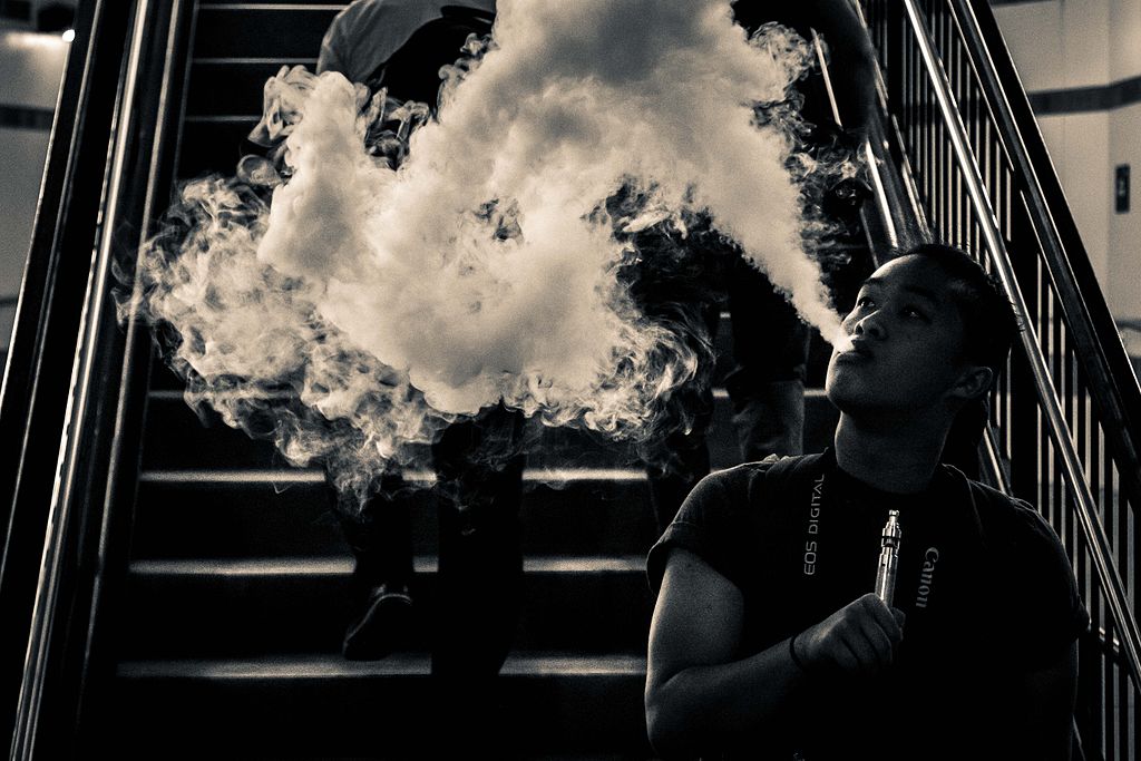E-cigarette user blowing a large cloud of aerosol (vapor). This activity is known as cloud-chasing.
